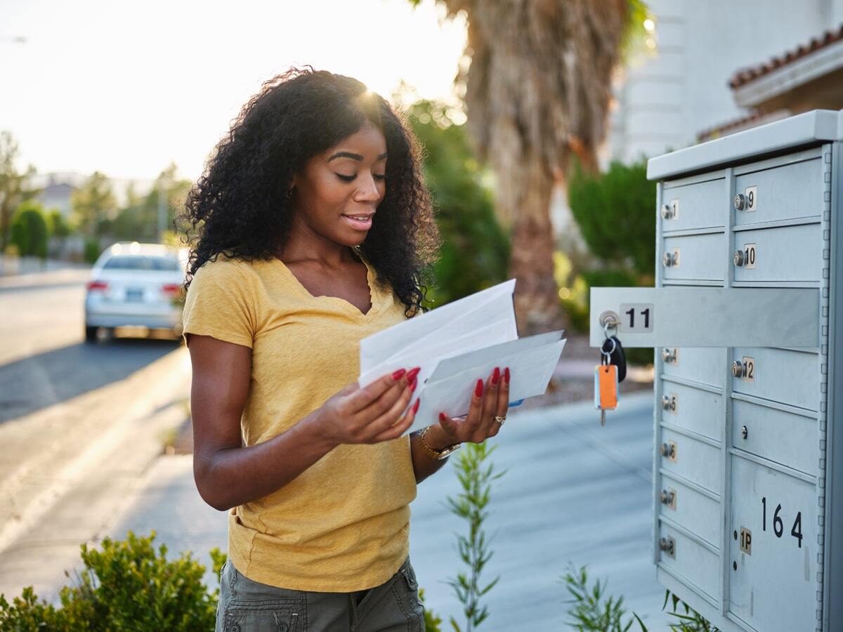 woman looking at mail