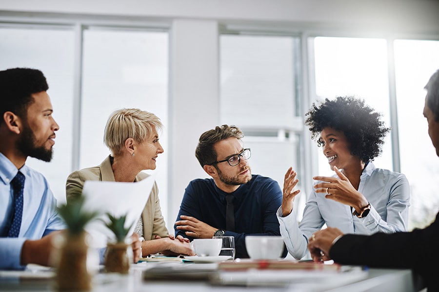 Group of people talking at a table