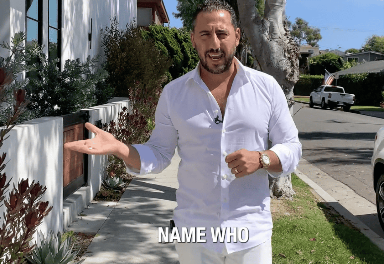 josh altman in front of houses